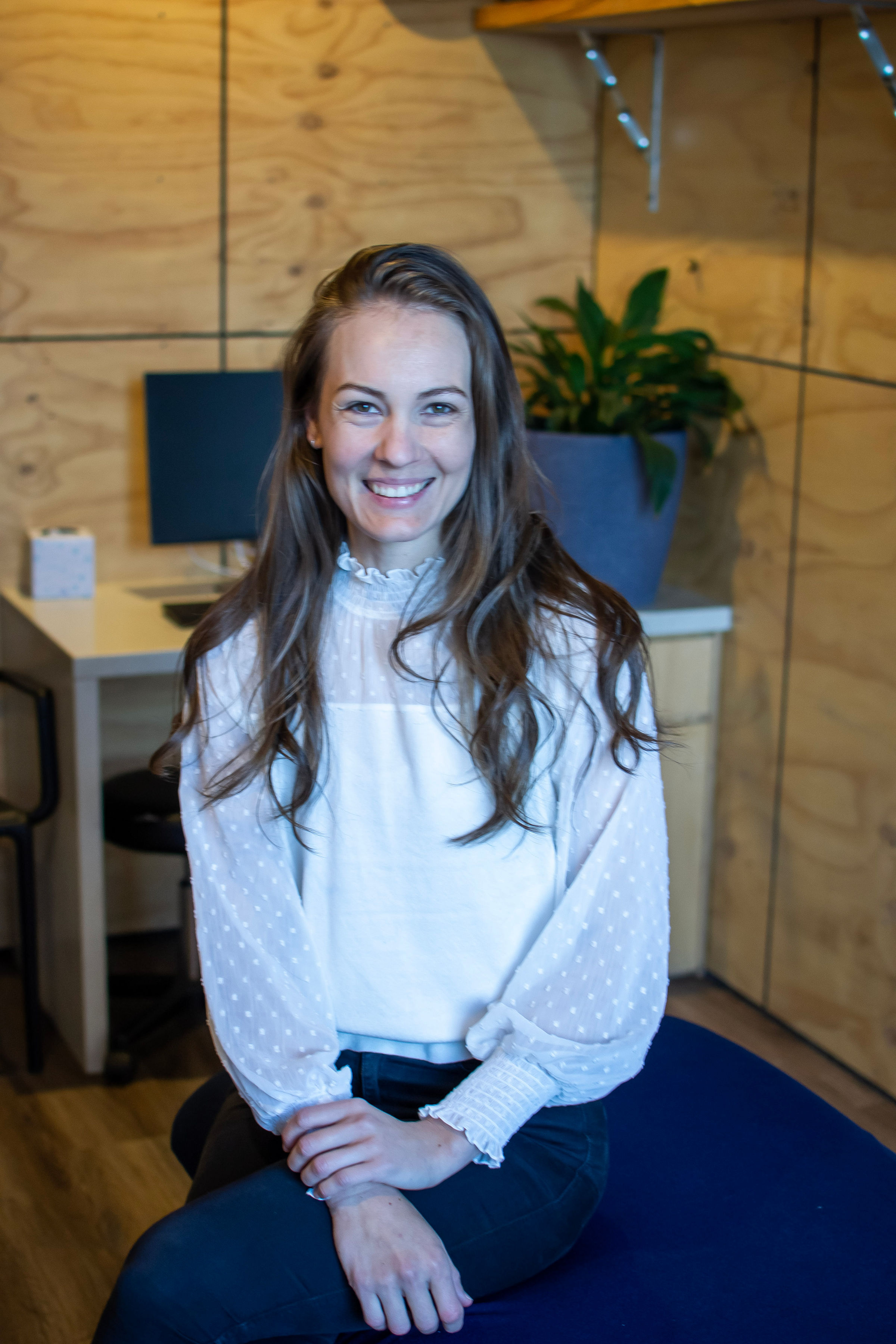 Andrea Dalton smiling at her desk